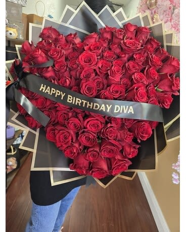 Large bouquet of red roses with a birthday ribbon