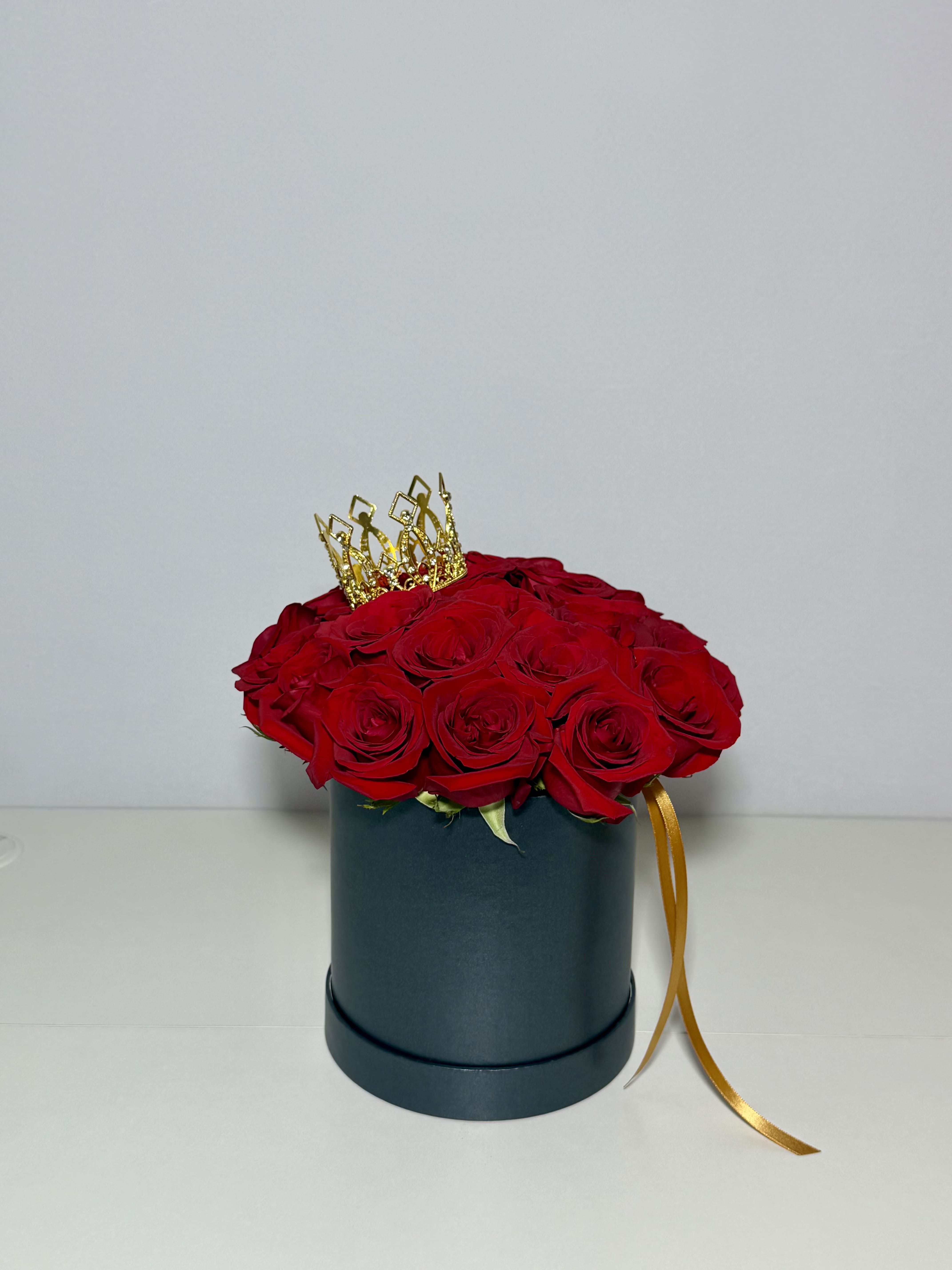 Love Box  - A timeless expression of love, elevated. Designed with luxurious red roses in an elegant black cylinder box, this arrangement was made for meaningful moments and unforgettable reactions.