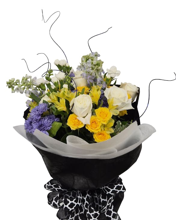 Bring the Sunshine Cellowrap - Sunlit yellows, soft whites, and lavender-purples are gathered into a lively hand-tied arrangement designed to make someone feel celebrated-the perfect choice for graduation, congrats, or any special milestone. The bold black wrap and patterned ribbon give the bouquet a modern, confident edge while long curly stems add playful height and movement.  This medium-sized wrap is finished with white tissue and contrasting black outer paper for a striking presentation that reads as both joyful and refined. It arrives ready to gift for birthdays, thank-yous, or to mark a new chapter-no fuss, just a bright, show-stopping moment for the person you're celebrating.