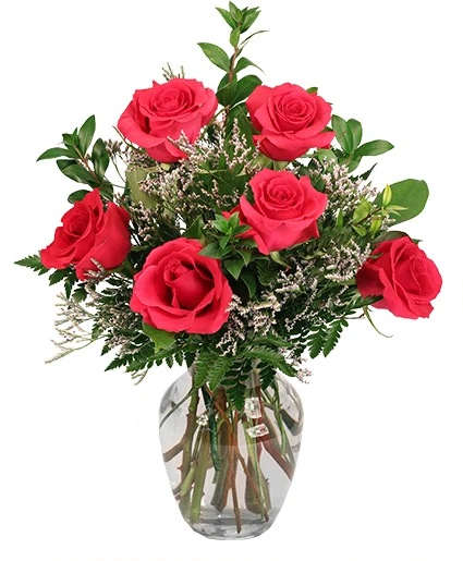 Bouquet of red roses in a clear glass vase