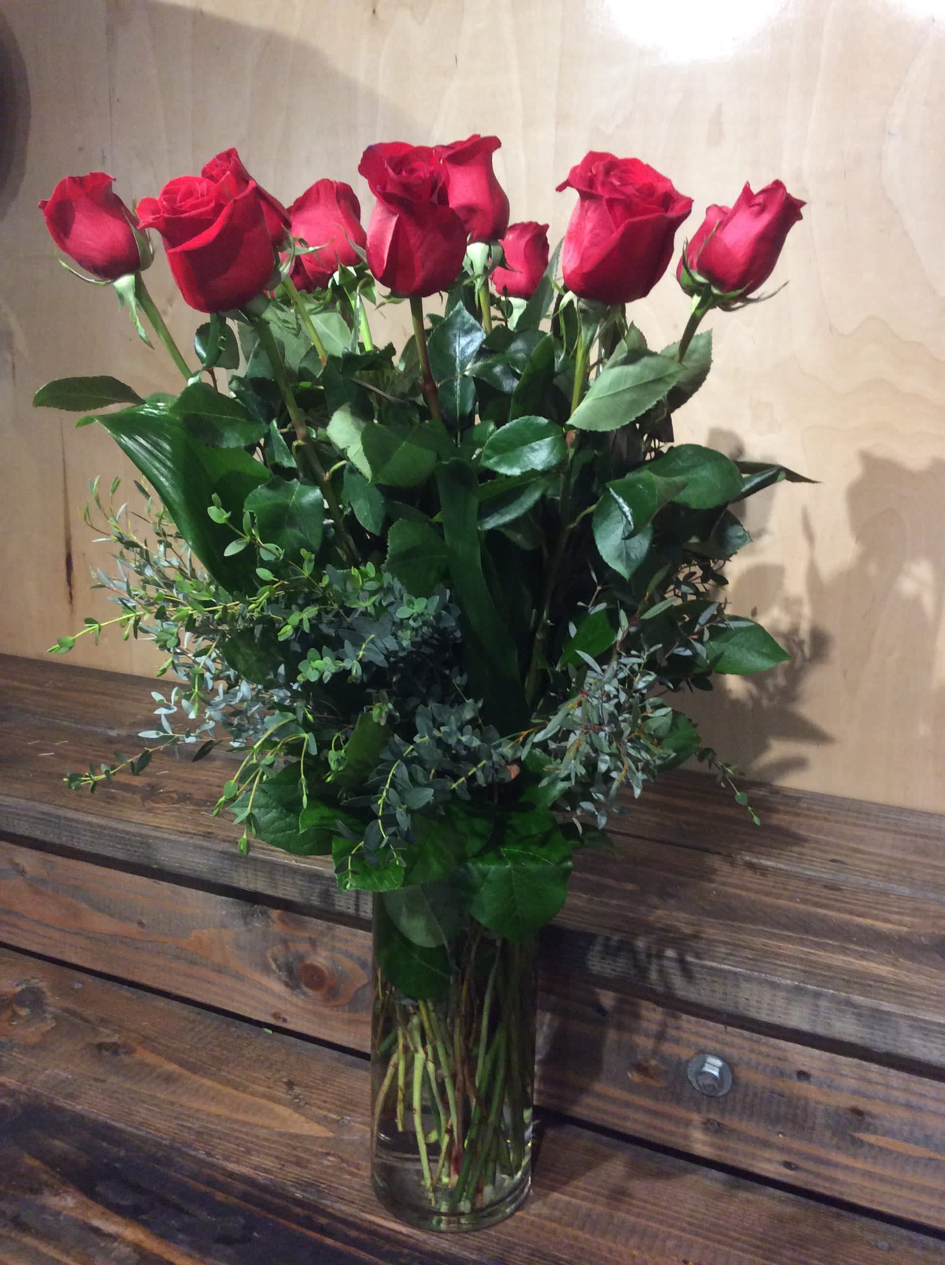 # 9._ Traditional Dozen Roses - 1 dozen roses arranged with greens in a cylinder vase.
