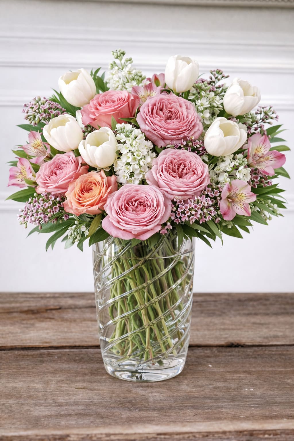 Love You in Crystal Vase  - Treat a mother in your life with a lush bouquet of spring florals in a large Julia crystal vase. This is a gorgeous arrangement placed in an elegant vase that will last beyond Mother's Day. 