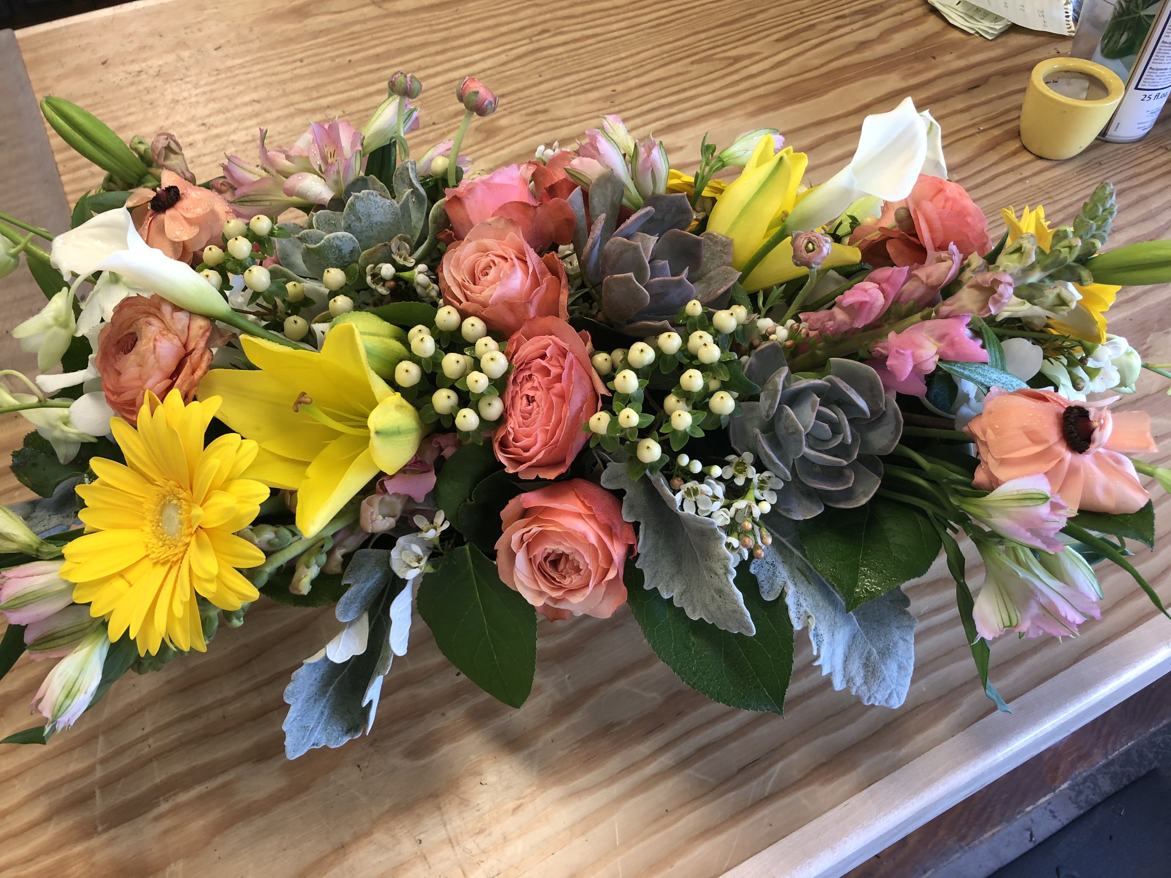 Mixed bouquet with pink roses, yellow lilies, and white calla lilies