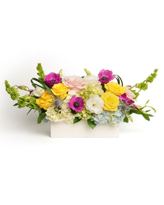Petals and Poise - Elegant and bright, this centerpiece celebrates the cheerful, blossoming spirit of spring.