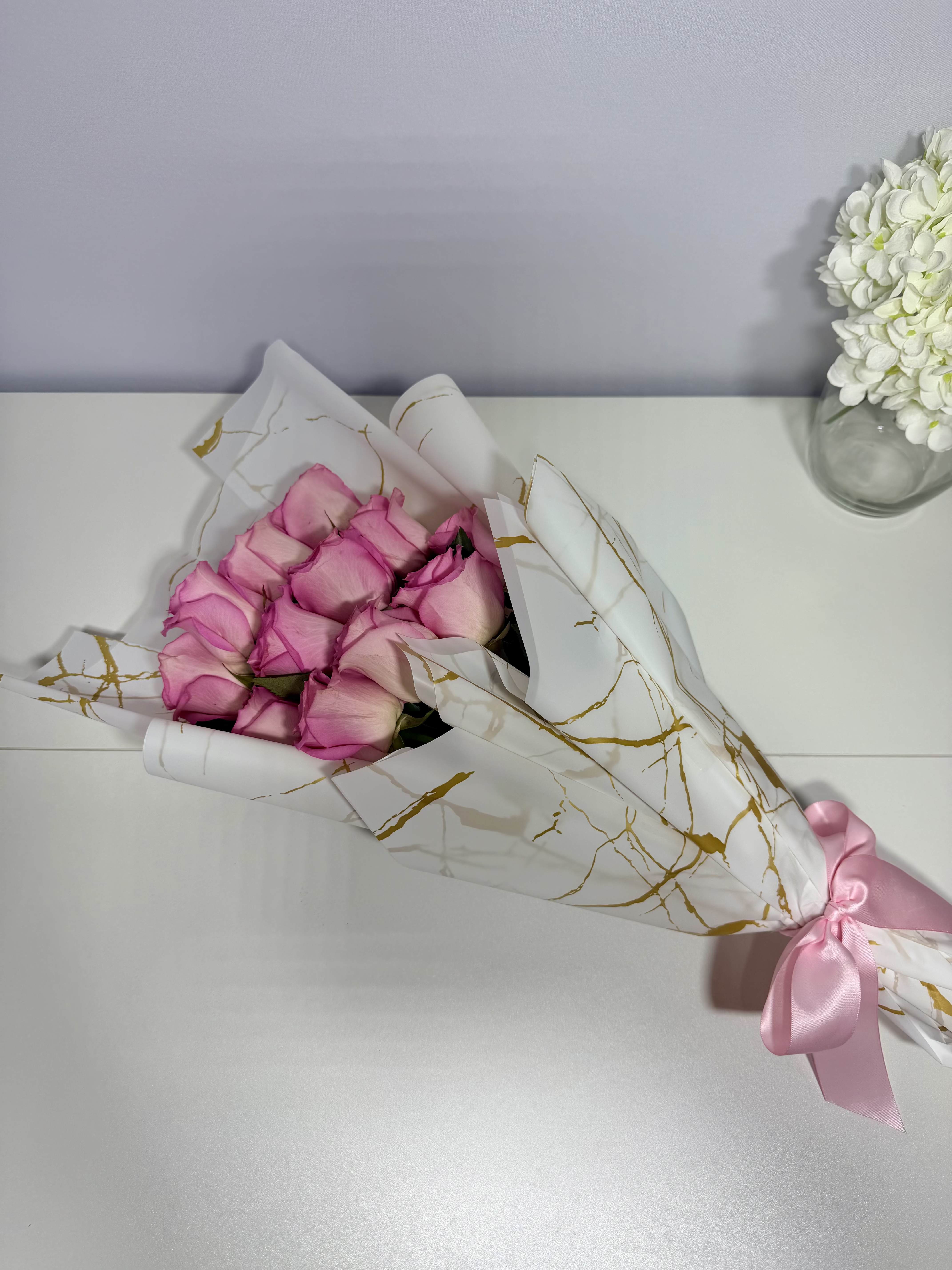 Golden Blush bouquet - Delicate blush roses beautifully wrapped in elegant white and gold paper, thoughtfully designed for sweet and memorable moments.