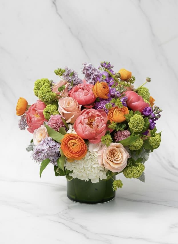 Grand Garden Party - A gorgeous and luxurious presentation of pink peonies, white hydrangeas, lilac, viburnum, hyacinth and more. Sure to impress!