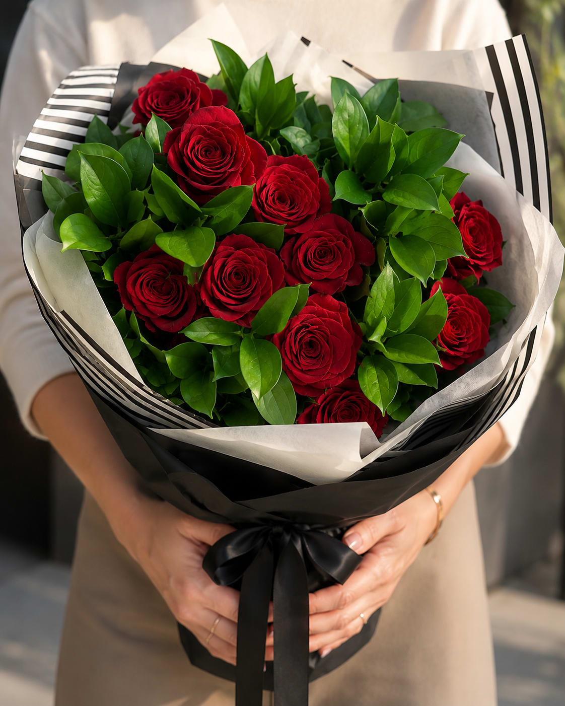 Red Rose Romance Wrapped - Dozen of premium red roses and touch of seasonal blooms. Deluxe wrapping.