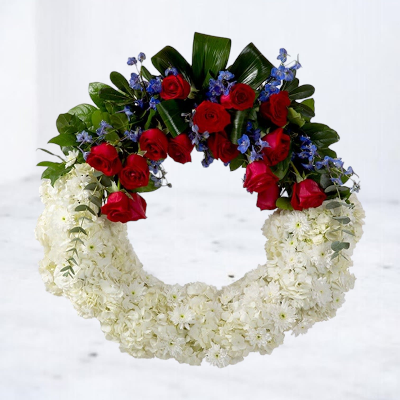 American Soul Funeral Wreath - A perfect way to honor their beliefs and actions, this red, white, and blue wreath is a tribute to those who loved their country. 