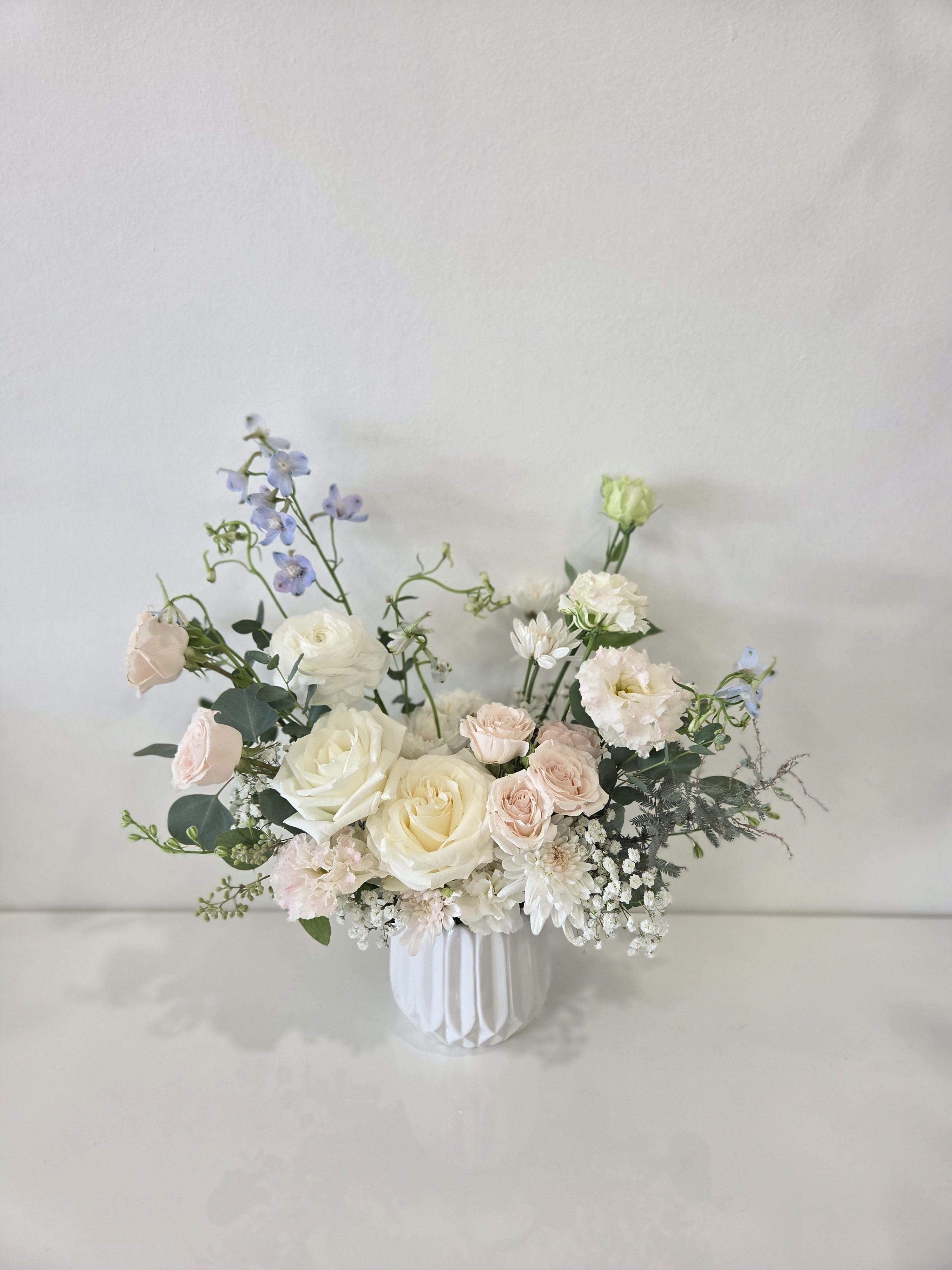 A Sweet Gesture  -  Vase Arrangement :  about W 13" X H 14"  Store Hours Mon–Fri: 9:30 a.m. – 6:00 p.m. Sat: 9:00 a.m. – 4:00 p.m. Sun: Closed  Delivery Deliveries are typically made between 9:00 a.m. and 3:00 p.m. While we are unable to guarantee specific delivery times, we will always do our best to accommodate your requests. If you prefer a later afternoon delivery, please let us know in advance and we will try to accommodate. If your delivery address requires a gate code, please provide it to ensure smooth delivery.  Pick-Up If you need to pick up before 10:00 a.m., please text us directly to place your order. (Text: 714-715-1482) For pick-ups at opening time, we kindly ask that orders be placed by 4:00 p.m. the day before. Please also try to pick up your order at the scheduled time. When pick-ups are delayed during busy time slots, it may affect other customers placing orders for the same time. We appreciate your understanding!  Custom &amp; Event Orders For 1st B-Day Party or Baby Shower flower orders, please text us first with your preferred date, size, quantity, and detailed color/ design requests before placing an order.  For small event or custom flower orders requiring pick-up outside of our regular business hours, please contact us via text in advance to arrange your order.  Thank you!!