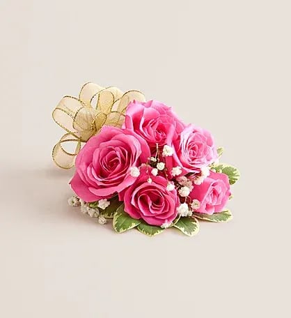 Hot Pink Spray Rose Corsage - A vibrant and stylish wrist corsage featuring hot pink spray roses arranged on a flexible, adjustable wristlet to comfortably fit any size. Perfect for proms, weddings, or special occasions, this corsage adds a pop of color and elegance to any outfit, combining beauty, comfort, and ease of wear.
