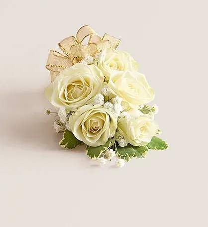 White Spray Rose Corsage - A classic and elegant wrist corsage featuring white spray roses arranged on a flexible, adjustable wristlet to comfortably fit any size. Perfect for weddings, proms, or special occasions, this timeless design adds a graceful and polished touch to the wrist, combining beauty, comfort, and effortless style