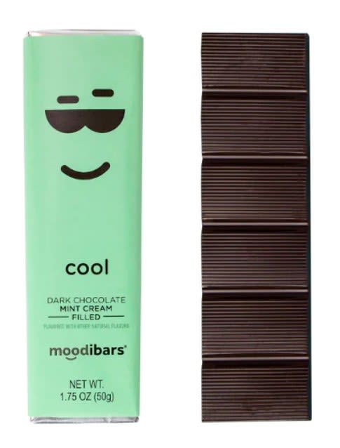Mint chocolate bar in green wrapper beside a dark chocolate bar