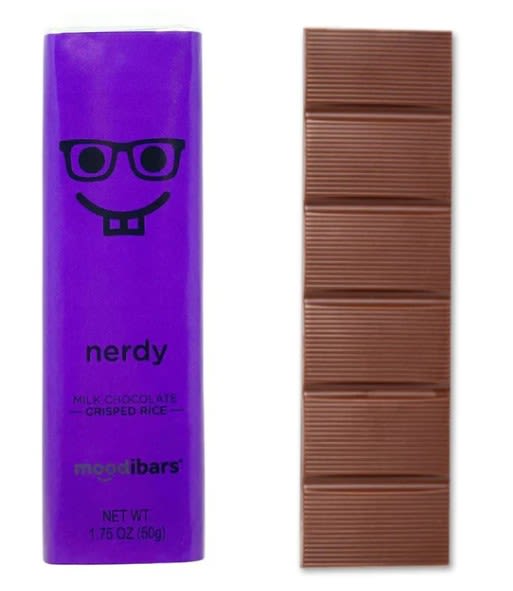 Purple chocolate bar wrapper beside a segmented milk chocolate bar.