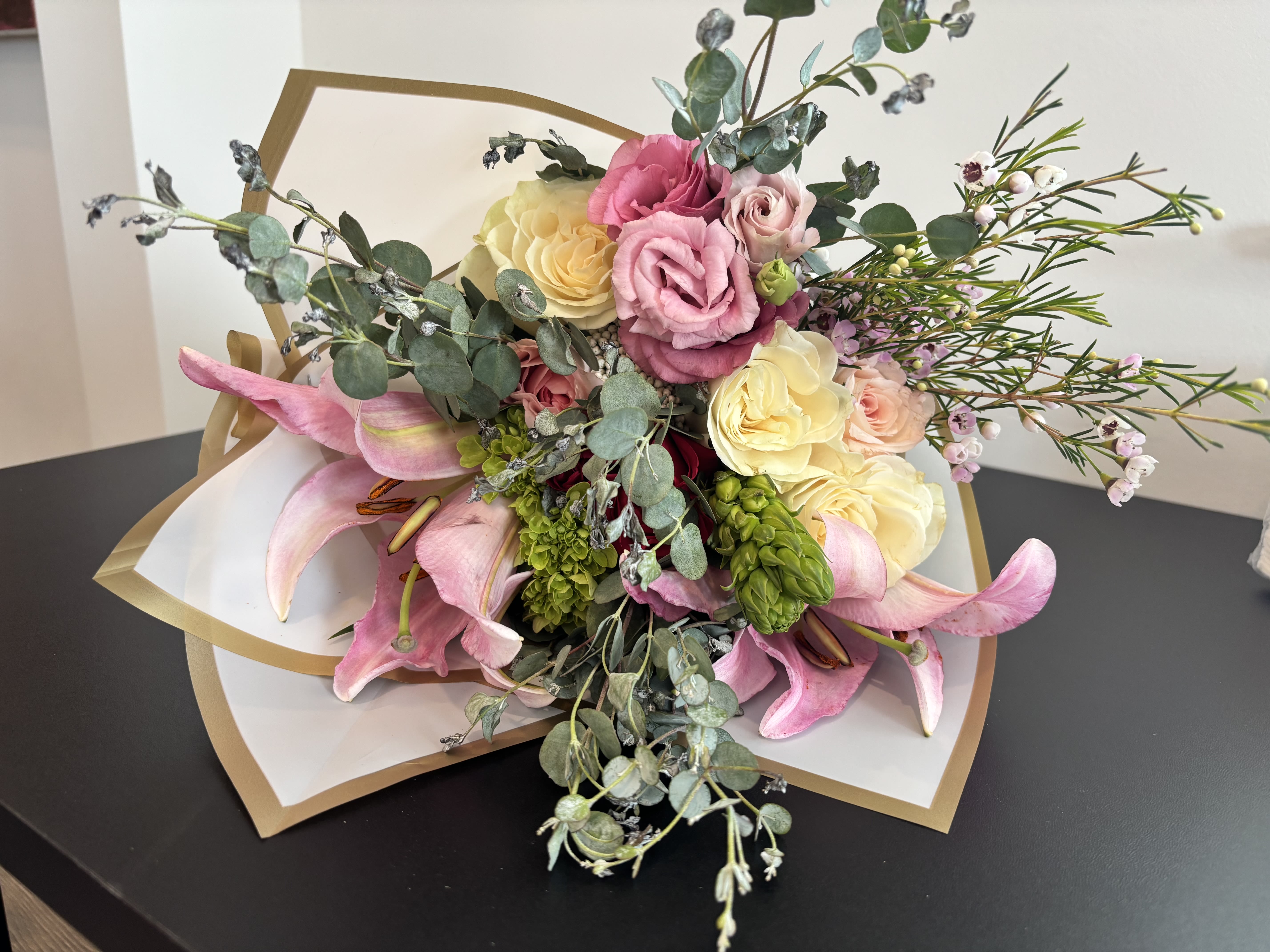 Signature Graduation Bouquet (Wrapped Bouquet) - Celebrate your graduate with a cheerful, boutique-style graduation bouquet from A Ray of Sunshine Floral. Thoughtfully designed with fresh seasonal flowers, this hand-tied bouquet is perfect for high school graduations, college graduations, dance recitals, and milestone celebrations in Hilliard, Dublin, Upper Arlington, Grandview Heights, and Columbus, Ohio. Designed with care by our local family-owned flower studio, each arrangement is created to feel personal, bright, and celebration-worthy.