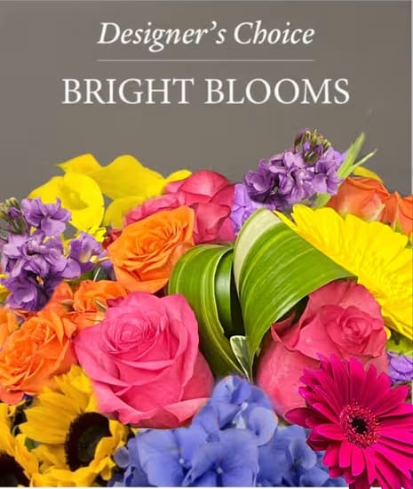 Summer Designer's Choice - A summer Designer’s Choice is a bright, seasonal arrangement created with the freshest blooms of the day. It captures the carefree energy of summer with vibrant colors, lush textures, and a natural, sun‑kissed style—each piece uniquely crafted by the designer for a cheerful, warm‑weather feel.