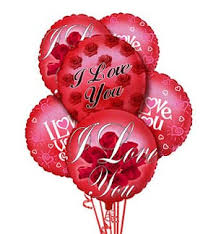 Cluster of red heart-shaped balloons with love messages