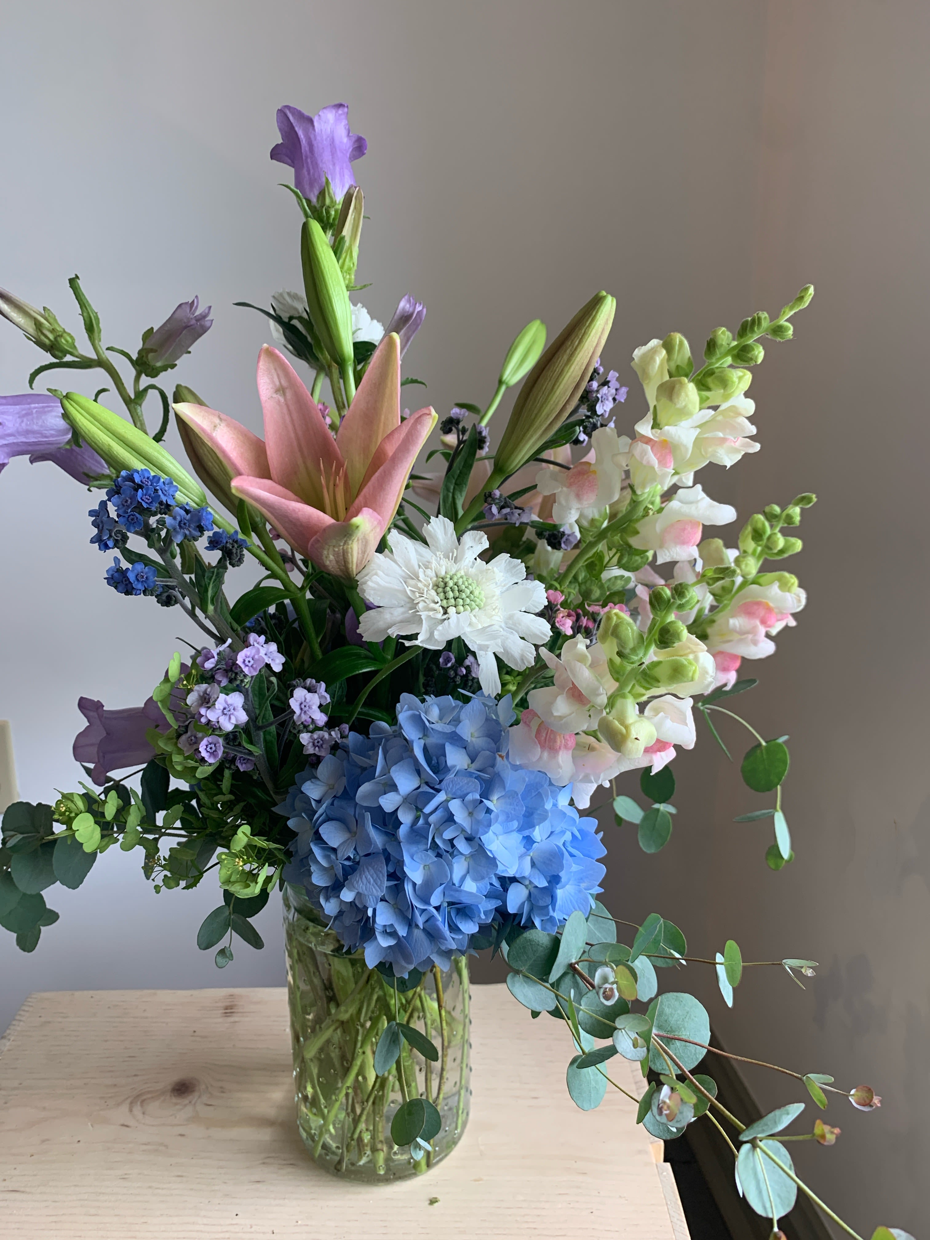 Welcome Little One - Send a beautiful seasonal mix of pinks &amp; blues or greens &amp; yellows to welcome new life into the world!   This arrangement will be displayed in a classic hobnob vase. Please let us know the preferred color palette for the recipient. 