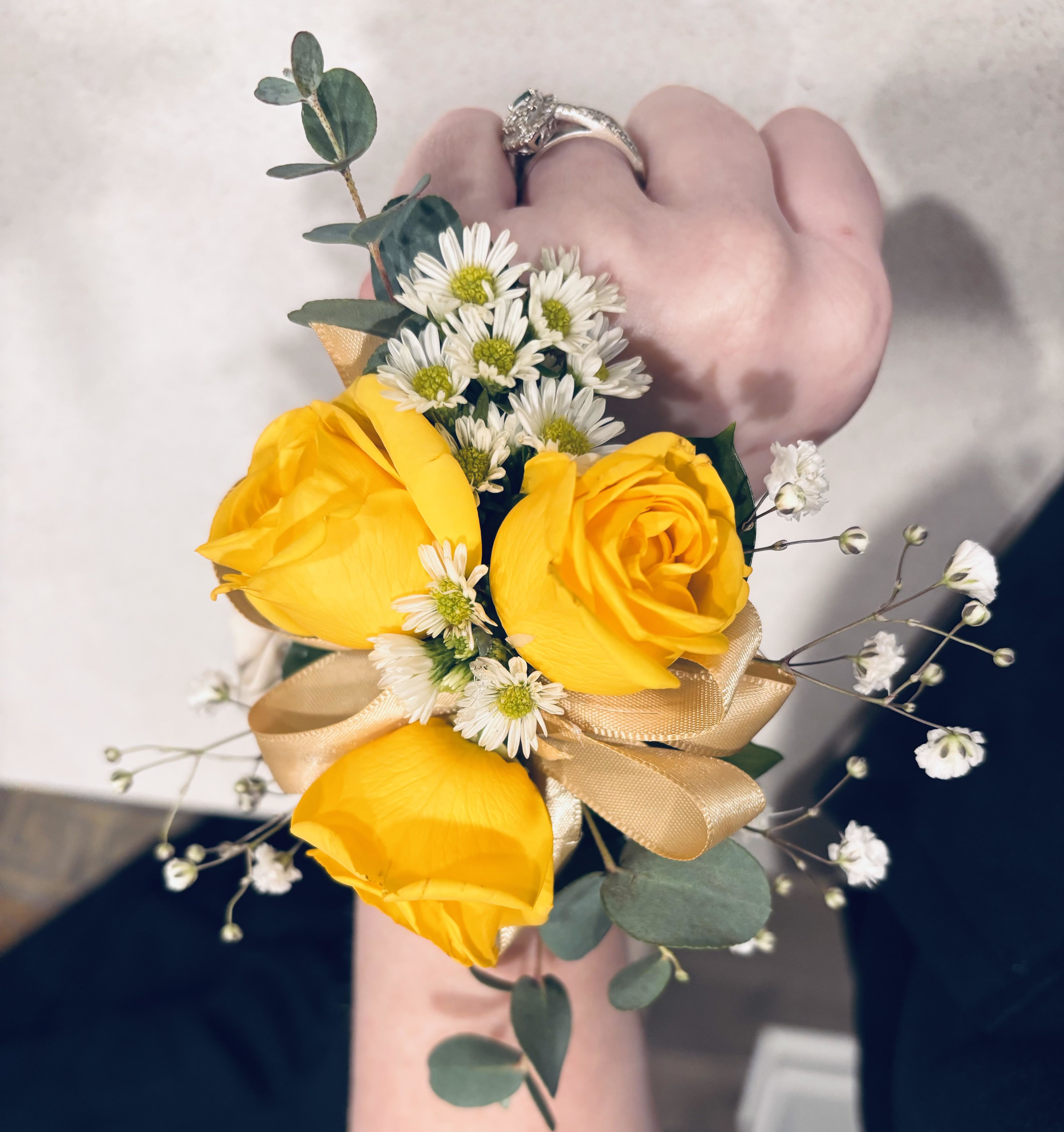 Signature Wrist Corsage - Designed with fresh seasonal blooms, layered textures, and ribbon detailing for a softer, more elevated look than traditional dance florals. Each piece is custom designed in our boutique style and thoughtfully created to complement your attire while still feeling natural and refined. Flower varieties and colors may vary slightly based on seasonal availability and designer selection.