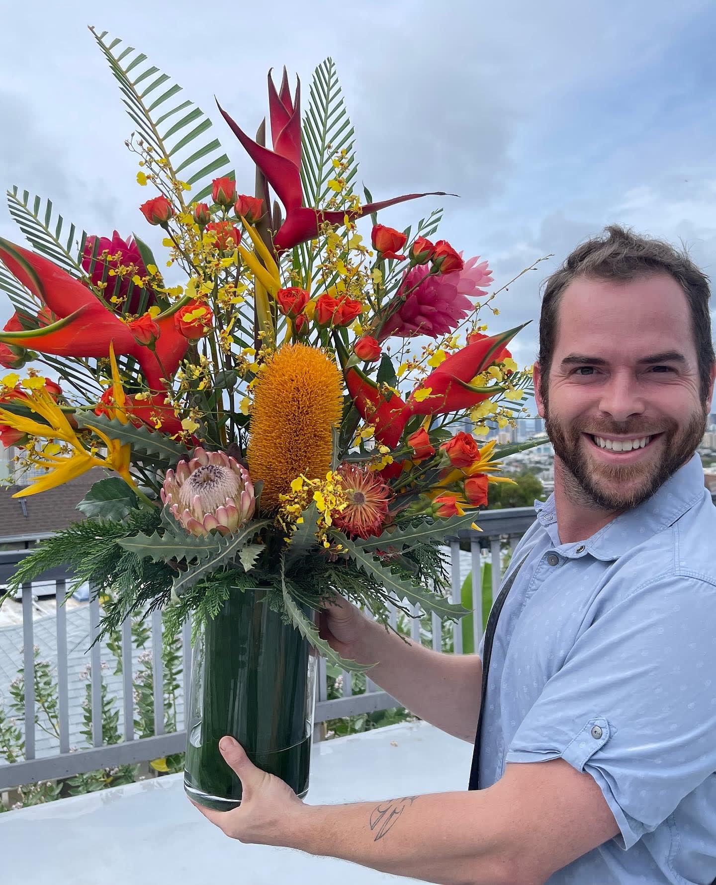 Tropical Sunset  bouquet - Yes sunset colored arrangement is inspired by the Hawaiian sunsets a fresh cut a seasonal tropical bouquet and sunset colors of red yellow and orange with a hint of purple this incredible exotic floral arrangement is perfect for any occasion and to share to please your loved ones 