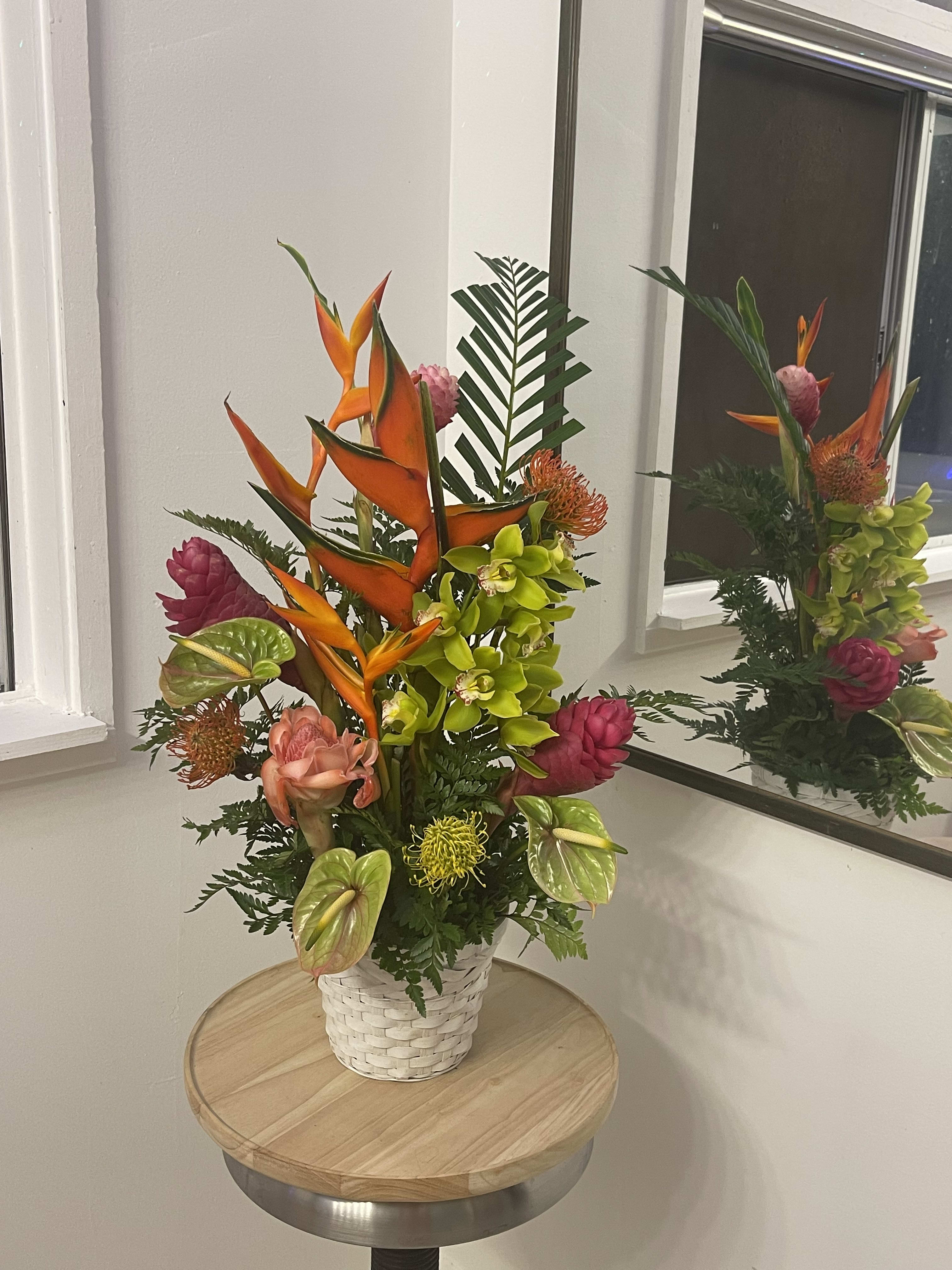 Tall and airy arrangement  in a basket  - A large beautiful display of tropical flowers in a basket  of seasonal, locally grown flowers  
