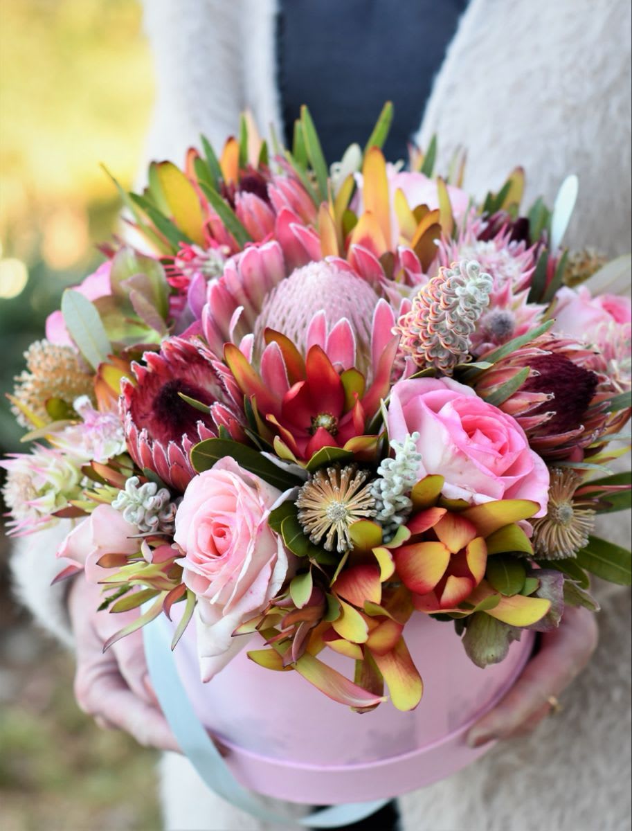 To the moon and back - Showcasing Hawaii’s finest blooms in a heartfelt arrangement with mixed tropicals and Proteus  designed with a  love 