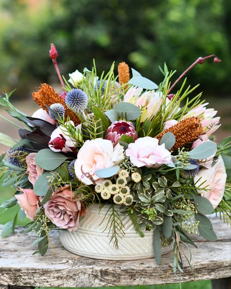 I miss you  - This floral arrangement is perfect for get well or a simply I just miss you this beautiful flower arrangement showcases Earthtones peaches light pinks A lovely arrangement for your grandparents or a wedding always perfect for a get well at the hospital 