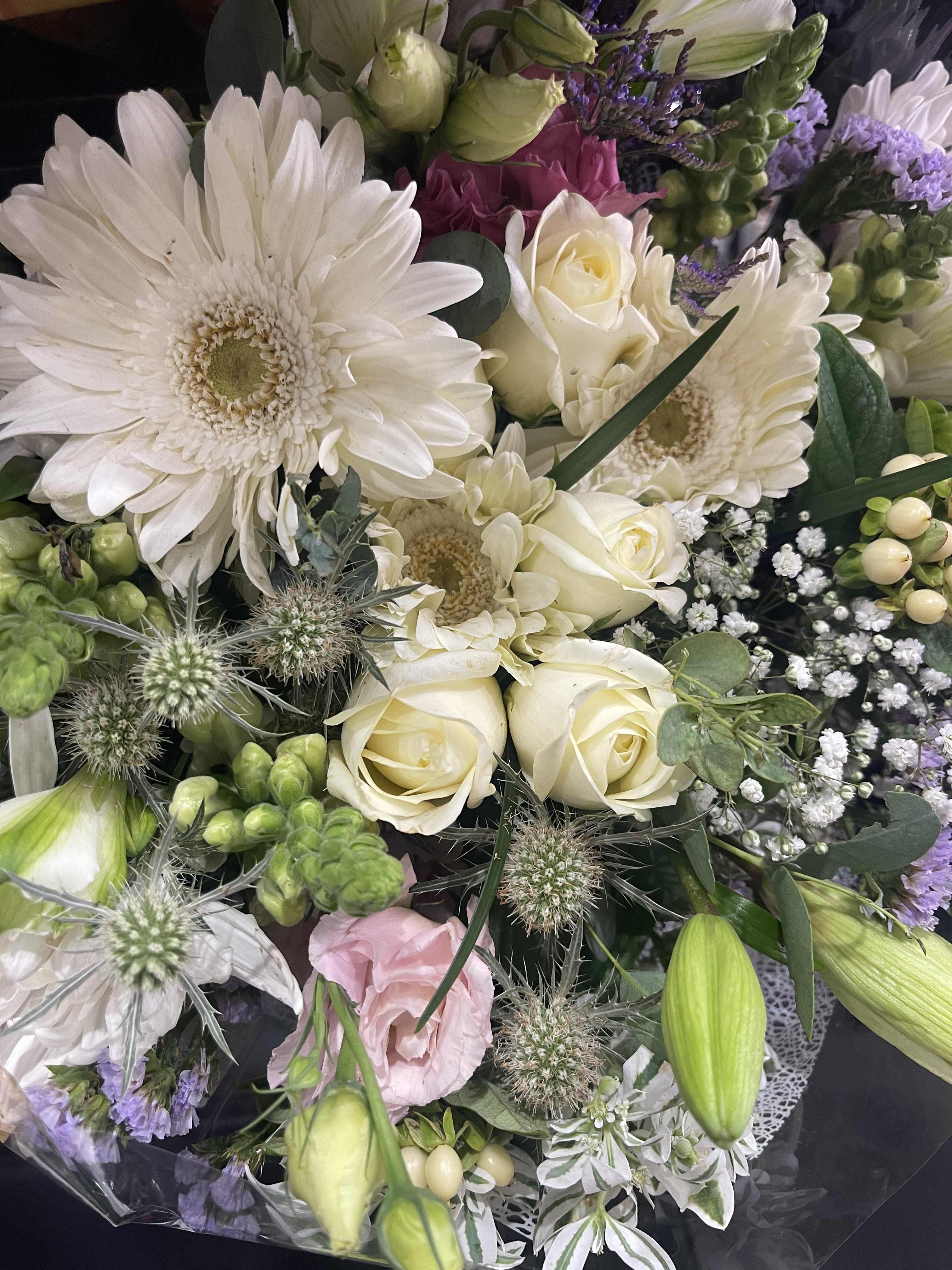 Blush and white color palette - Primarily white blooms and blush accents, a touch of pink This mixed dry wrap bouquet is perfect for a weddings or a simple goodbye to any funeral service 