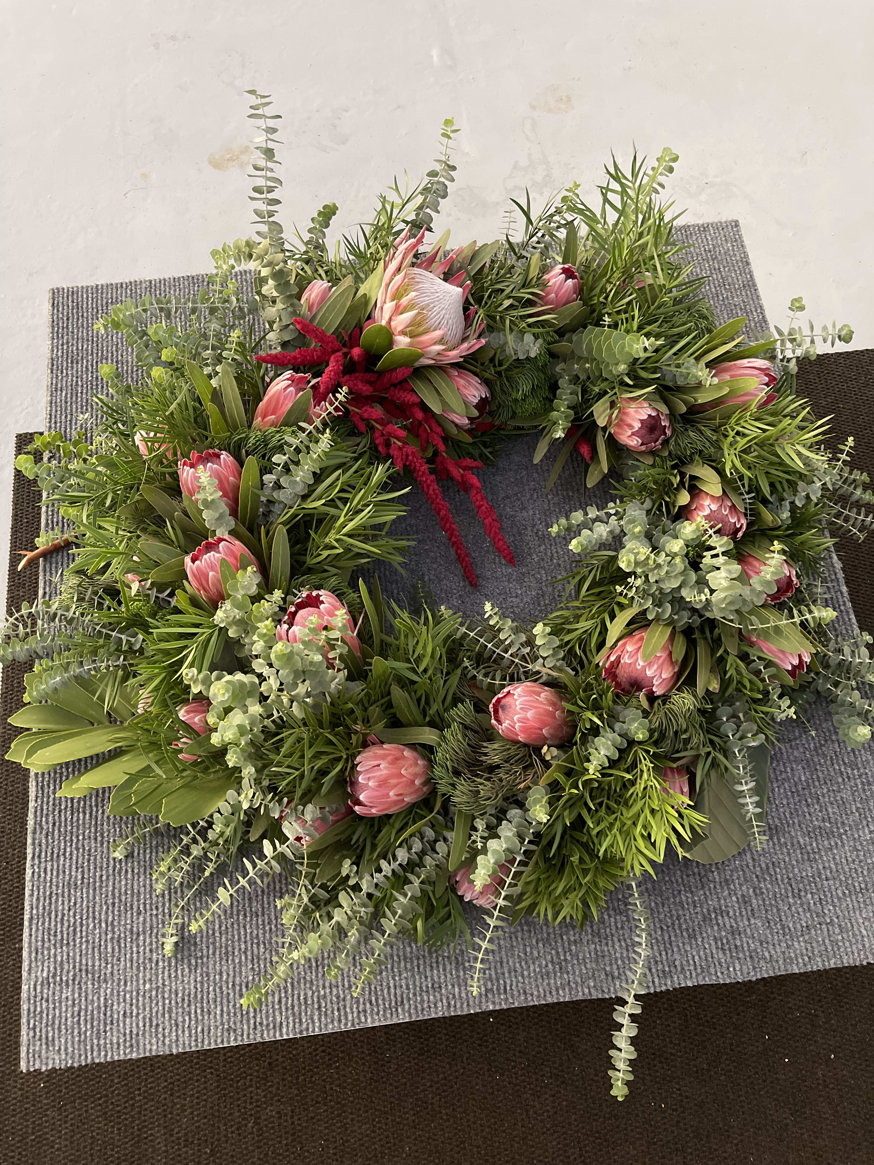 Seasonal Protea wreath florist choice - Seasonal Protea wreath florist choice This amazing fresh Protea a Floral wreath is not only amazing and beautiful it is long lasting a fun gift for your Ohana or neighbor a wonderful gesture to your loved ones for your special holiday and get together