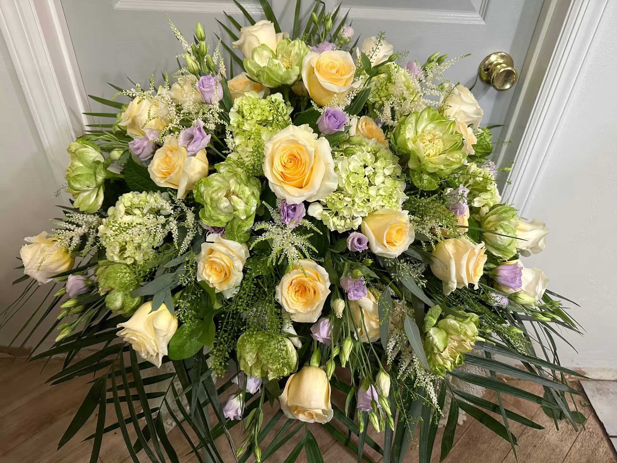 Yellow color, palette, casket saddle Spray  - A mixed yellow color, palette, casket, saddle, a plethora of cottage blooms with a mainland feel and exotic twist