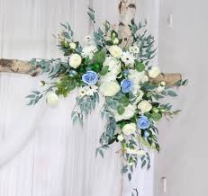 Two …….Blue and white tropical spray  - To tropical spray arrangements that can be strapped on to any Archway for your special moments wedding birthday and so much more these beautiful arrangements can be placed and mired wherever you like they will be delivered to the address of your choosing 