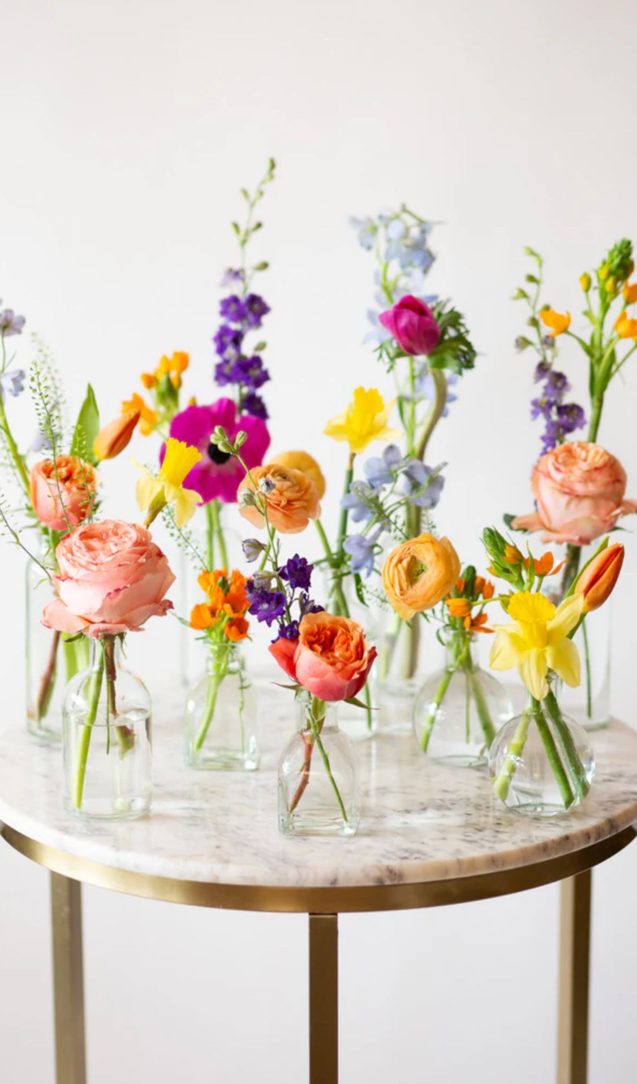 Single  Floral bud vases  - A Nice mix of your choice of color palette this package includes one floral arrangement and a bud vase placed delicately on each table setting 