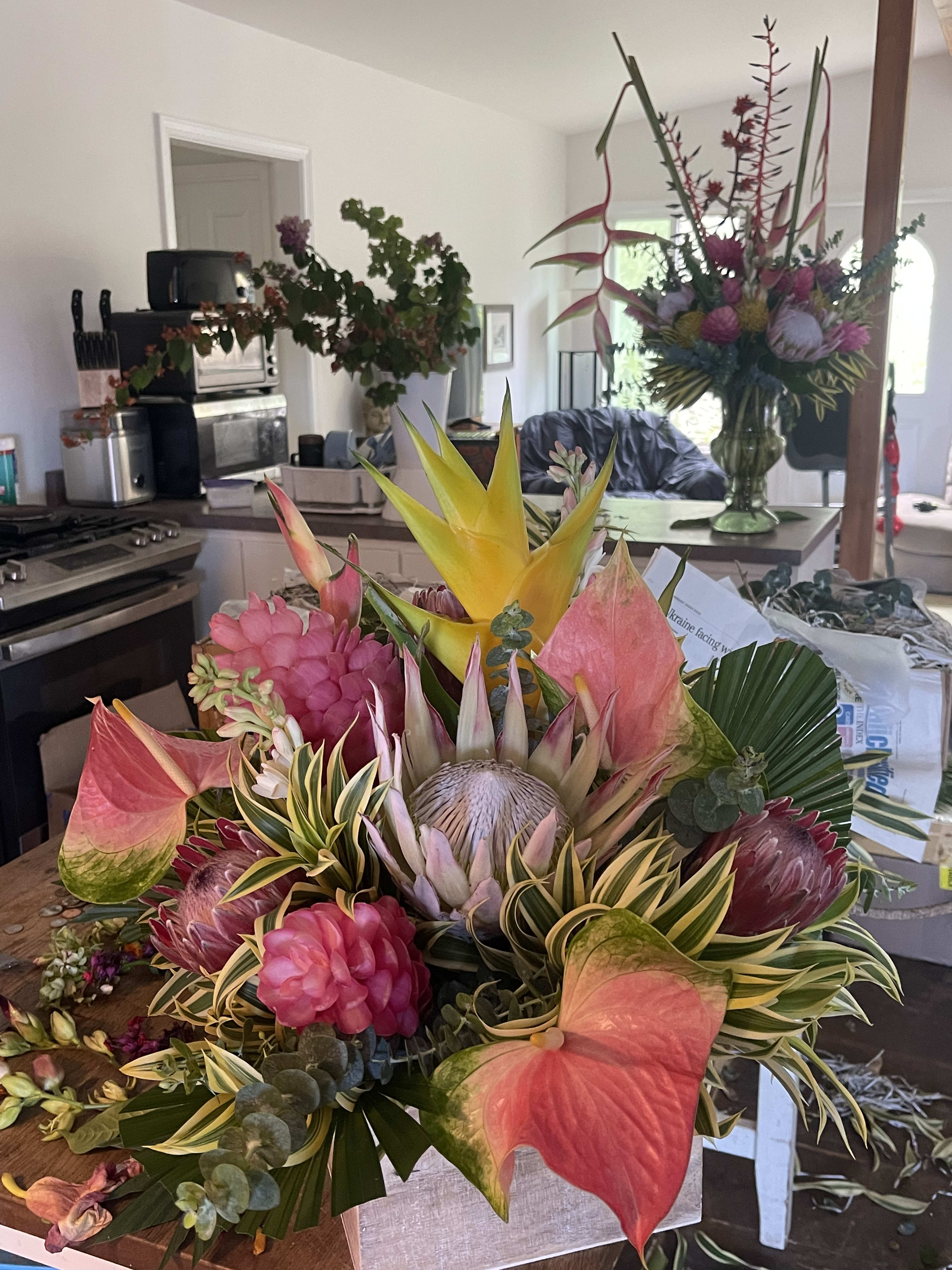 Two  exotic centerpieces in a grande style two black ceramic pots with  palm - This two piece exotic centerpiece package is perfect for any party get together corporate and private parties and your choice of color scheme and color pop   One tall one short  
