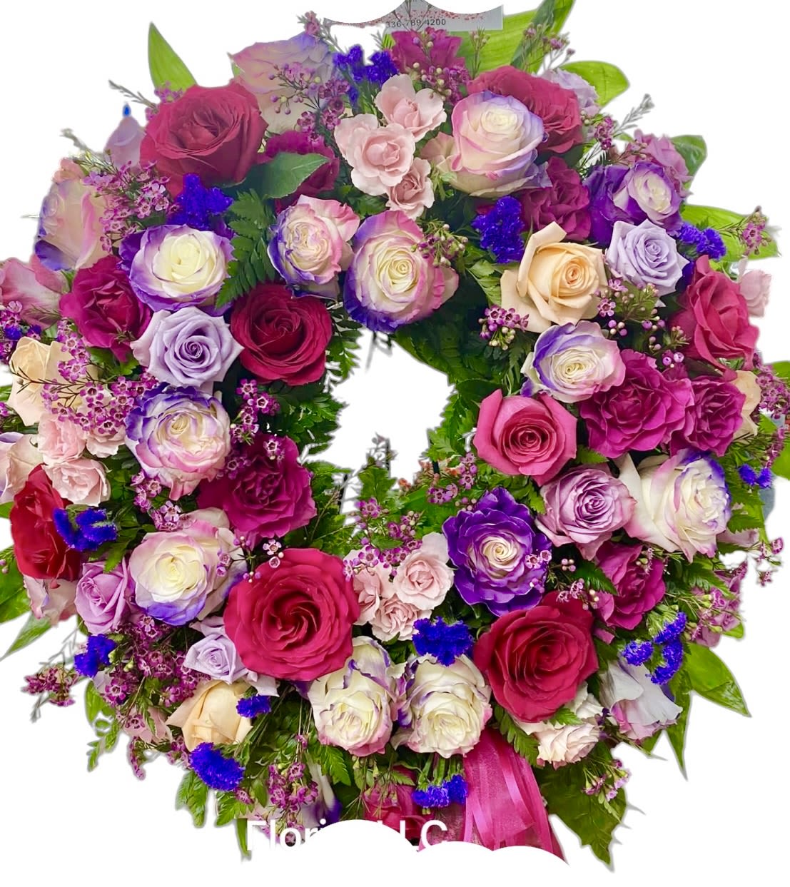 Heart-shaped bouquet of pink, purple, and cream roses