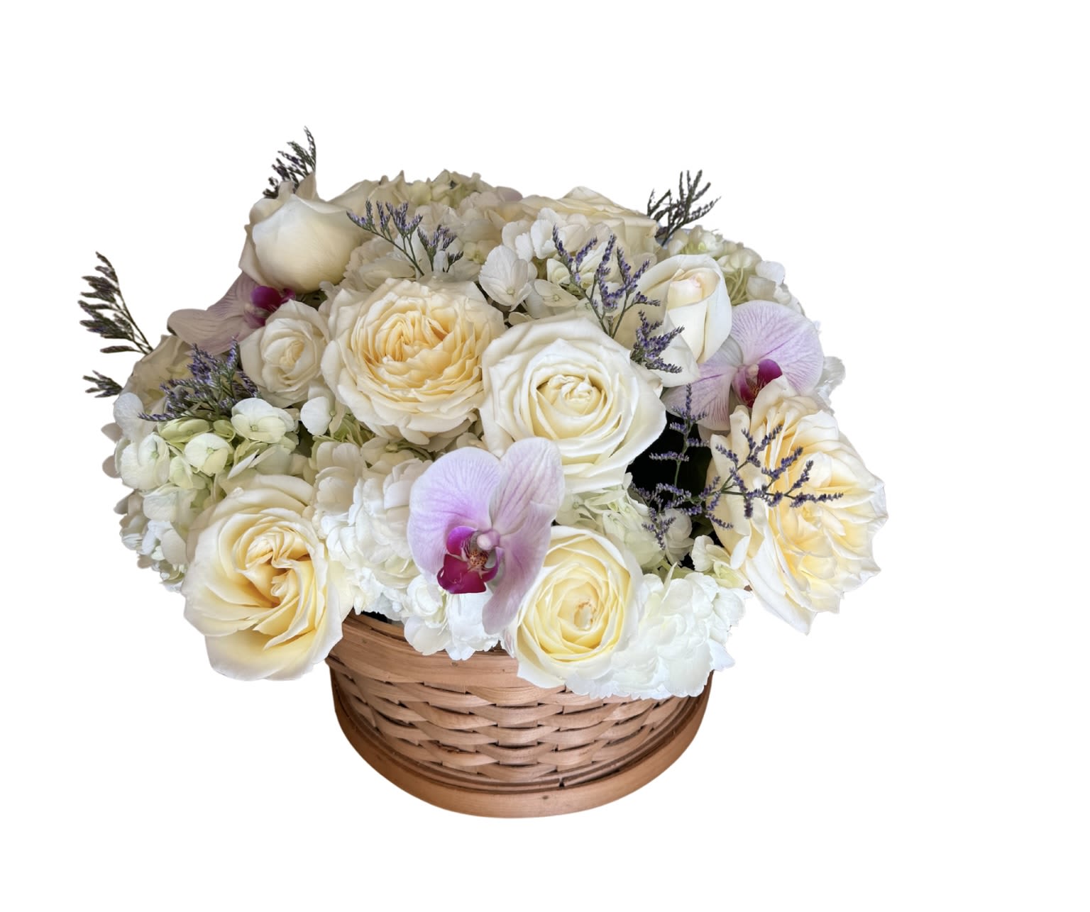 Basket of flowers  - Cream and white roses gathered with pale hydrangeas and soft pink Phalaenopsis orchids create a tender, romantic flower arrangement perfect as a Mother's Day gift, thank-you surprise, or a gentle everyday bouquet for Mom. The round wicker basket gives the presentation a classic, giftable warmth-she'll feel noticed and cherished the moment she sees the soft palette and full, lush shape.  This wicker basket arrangement combines cream and white roses, pale hydrangea blooms, a few soft pink orchids, and small sprigs of purple filler that add delicate contrast and airy texture across the top. The compact, dense cluster offers a generous visual impact without being fussy, and the neutral-pastel colorway complements many home styles and tabletops. Order this for birthdays, celebrations, or just-because moments when you want her to feel truly seen and loved.