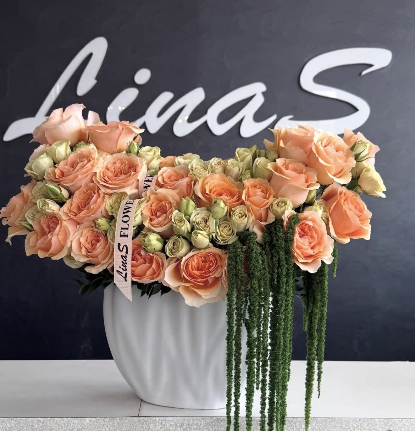 Peach Blossom Grace - A delicate peach-toned arrangement filled with warmth, softness, and elegance — a graceful expression of charm, beauty, and refined luxury.