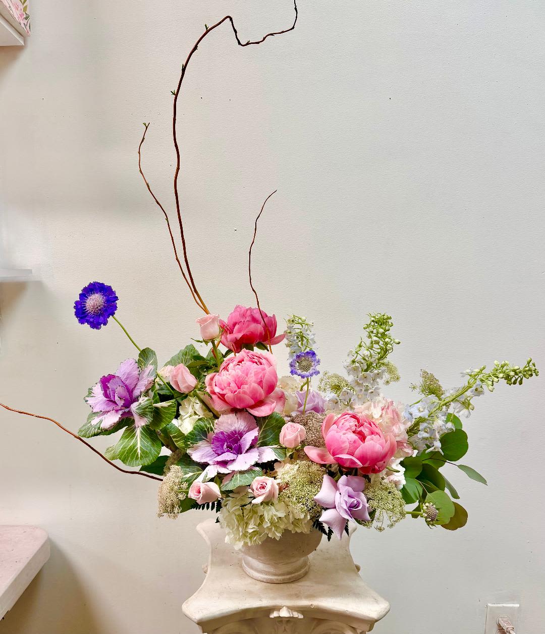 Cinderella - Product Information:  Arrangement Flowers: Peonies, Cabbage, Roses, Larkspur, Hydrangea, Delphinium,  &amp; greenery in vase. Color: blush pink, Purple and Blue. Arrangement may look different Substitution Policy: In some instances, our photo may represent an overall theme or look and include a one-of-a-kind vase which cannot be exactly replicated.
