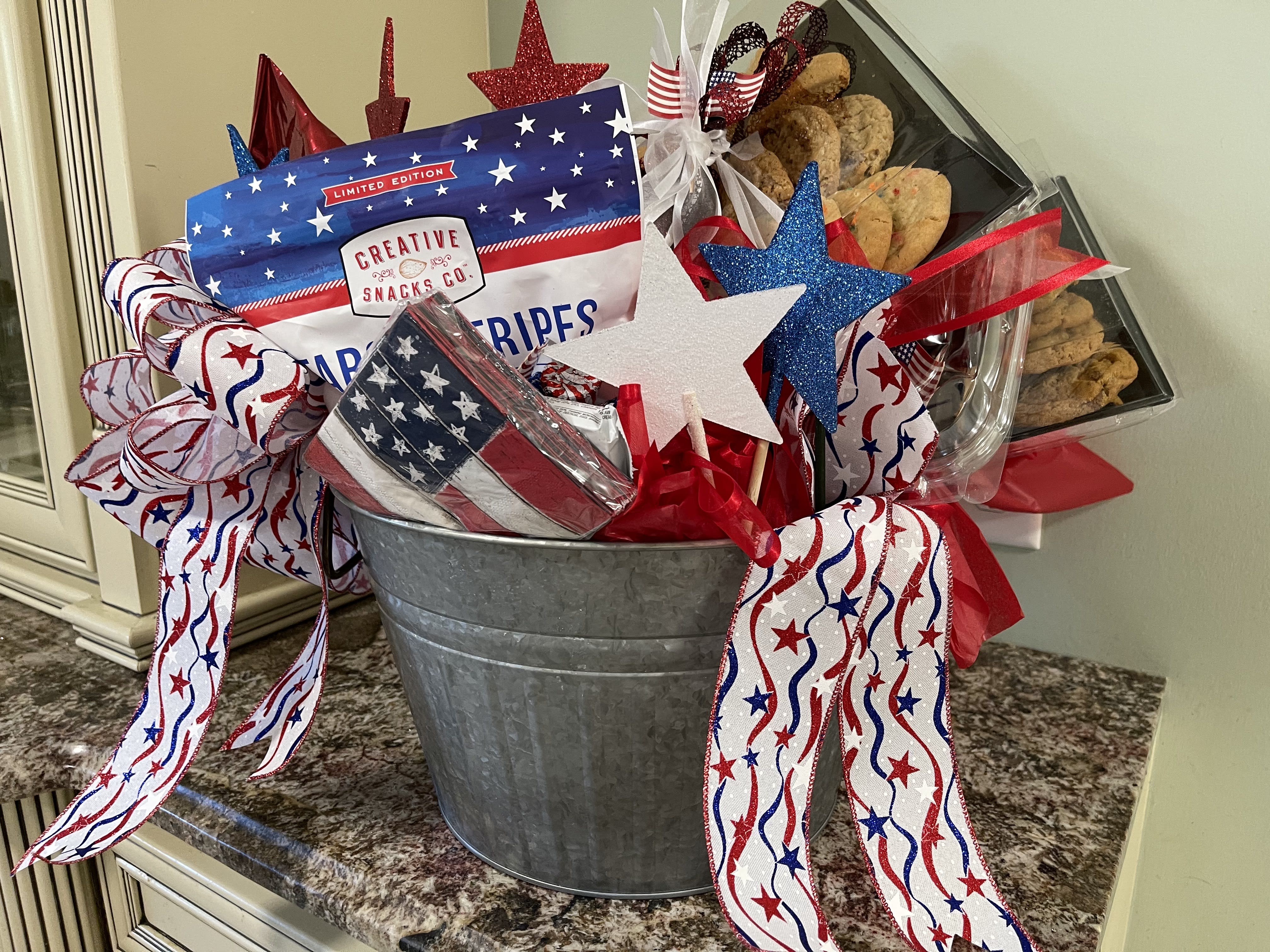 The Legacy Patriotic Celebration Bundle - Our patriotic bundle has everything you need to celebrate at the parade and fireworks.  We can build the bundle with a variety of snack, cheese, meats and drinks for you or build to your specific requests.