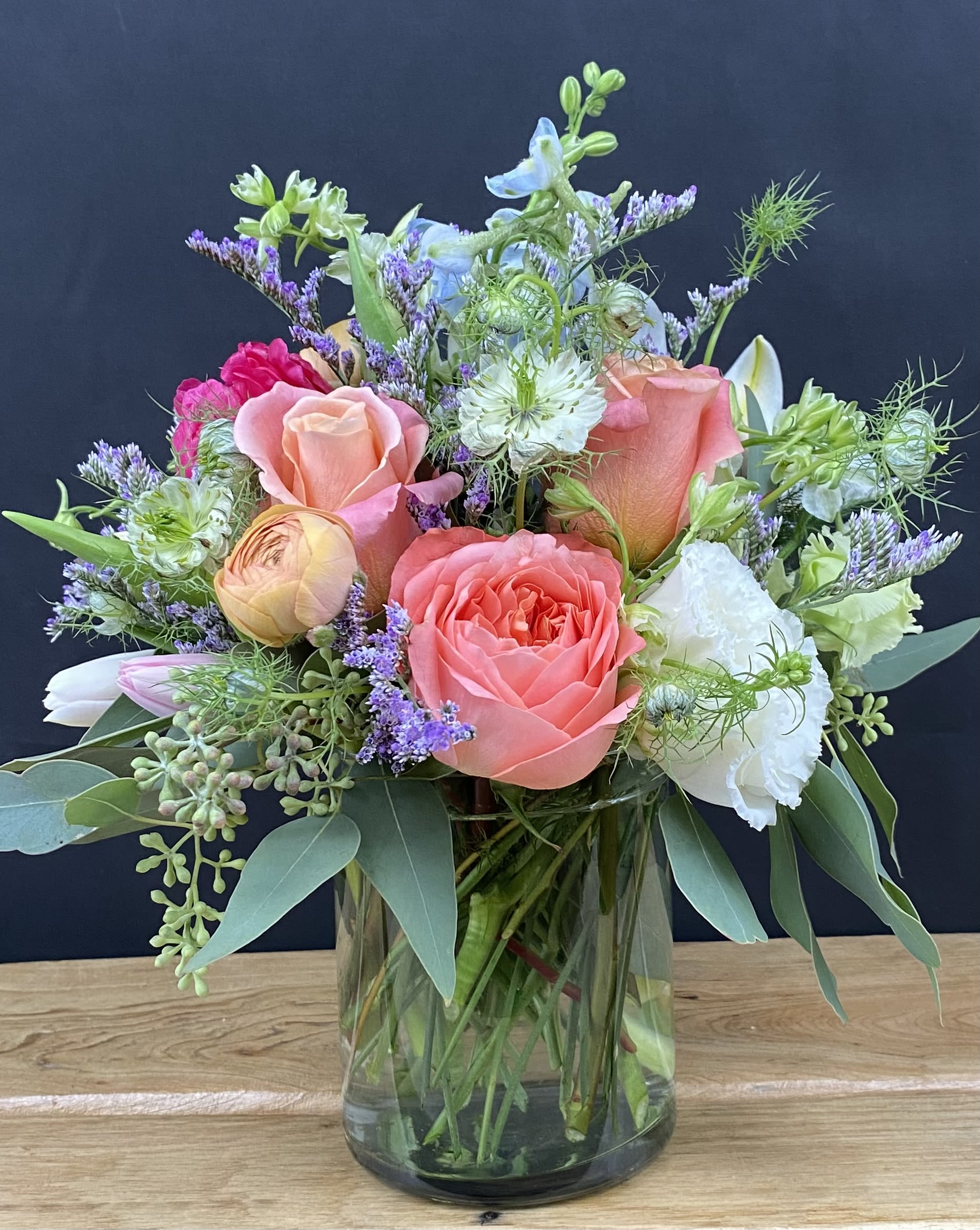 Sophia's Sweet Pastels - This arrangement includes a sweet mix of Garden Roses, Peonies, Lisianthus, Delphinium, Ranunculus and Tulips (when in season). 