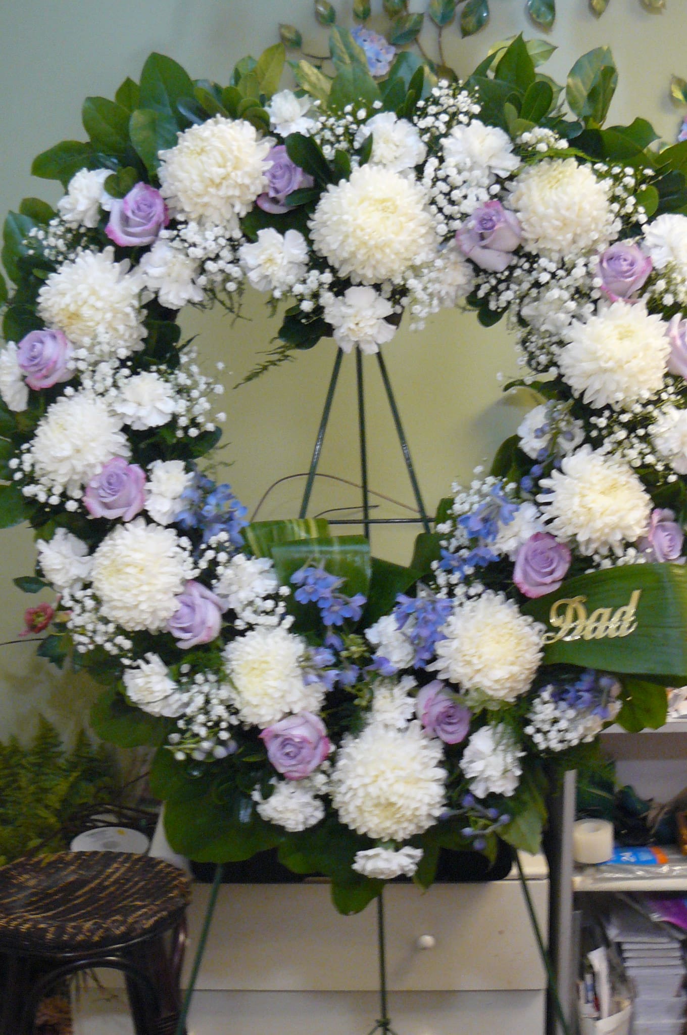 Heart-shaped floral wreath with white mums, lavender roses, and blue accents