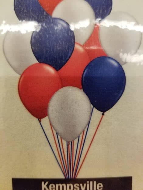Cluster of red, white, and blue balloons with strings attached