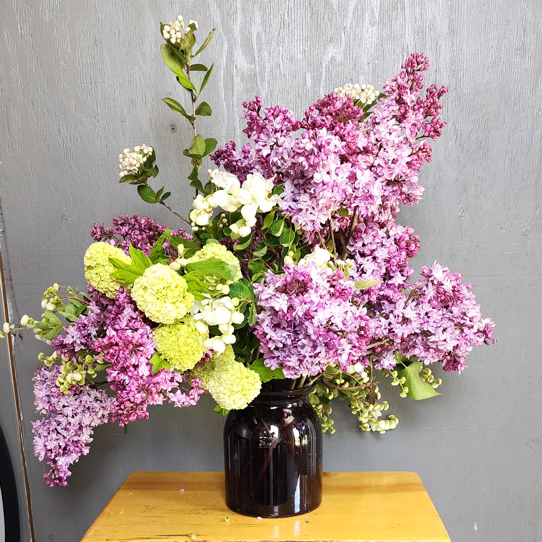 Lilac Love  - We are a small studio florist in a small town. Every bouquet we create is a one-of-a-kind creation, tailored to the season, availability of flowers, color choice, artistic interpretation, and the current materials available. The photos do not represent the exact flowers that will be delivered. They are intended to provide you with an idea of  the variance that can be expected.  The season, availability of flowers,interpretation, and the current materials available.  