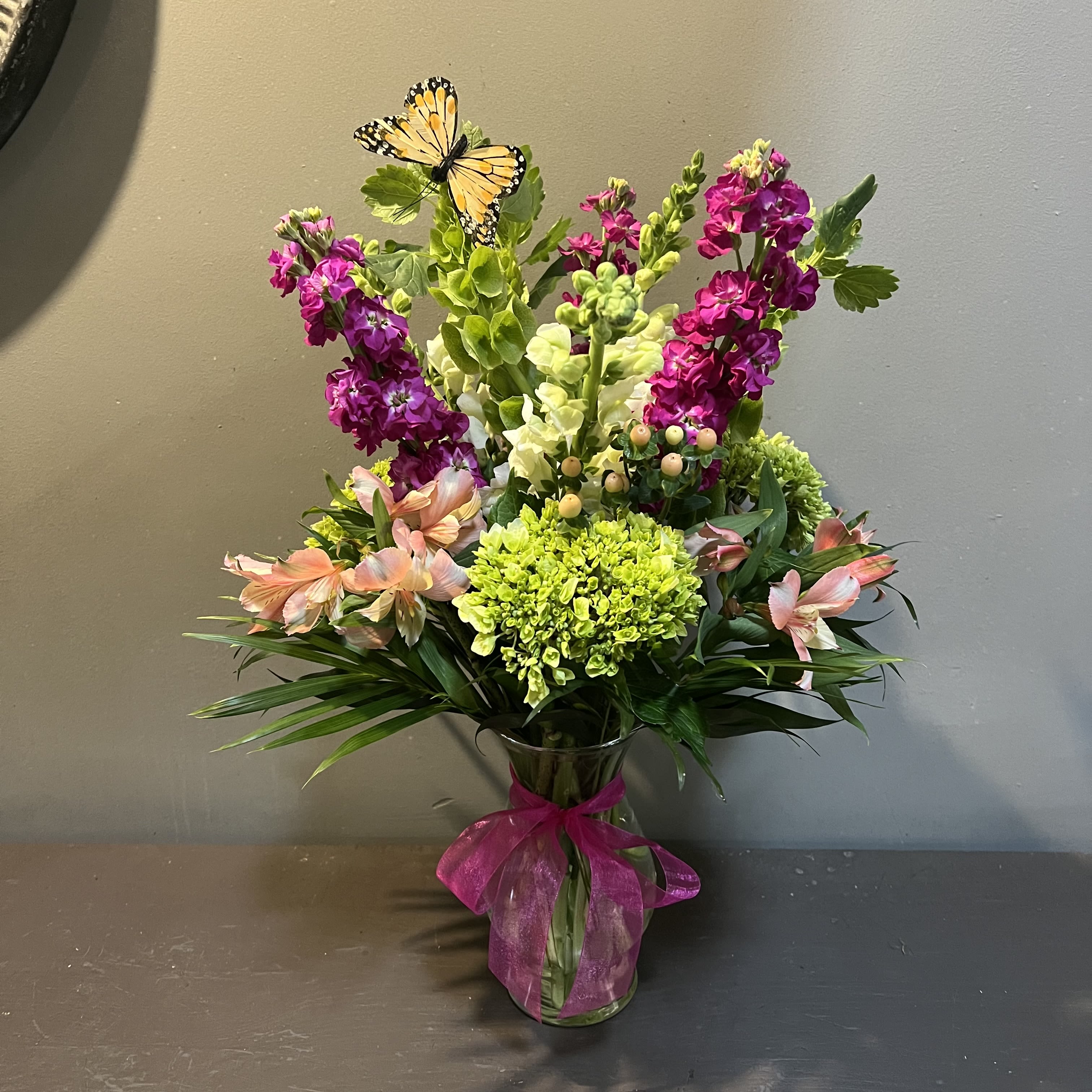 Butterfly Me to the Moon - This bouquet makes the perfect day brightener!  Measures 24Tx15"W and arrives in a glass vase with a butterfly on the bells' foliage.