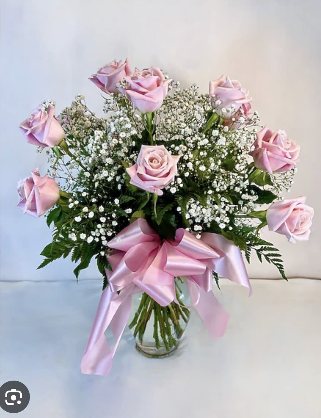 Dozen Pink Roses - Who doesn’t love a dozen pink roses arranged in a vase with babies breath and alstroemeria. The sweetest sentiment for your daughter or mom.  Roses may vary from light pink to deep hot pink.