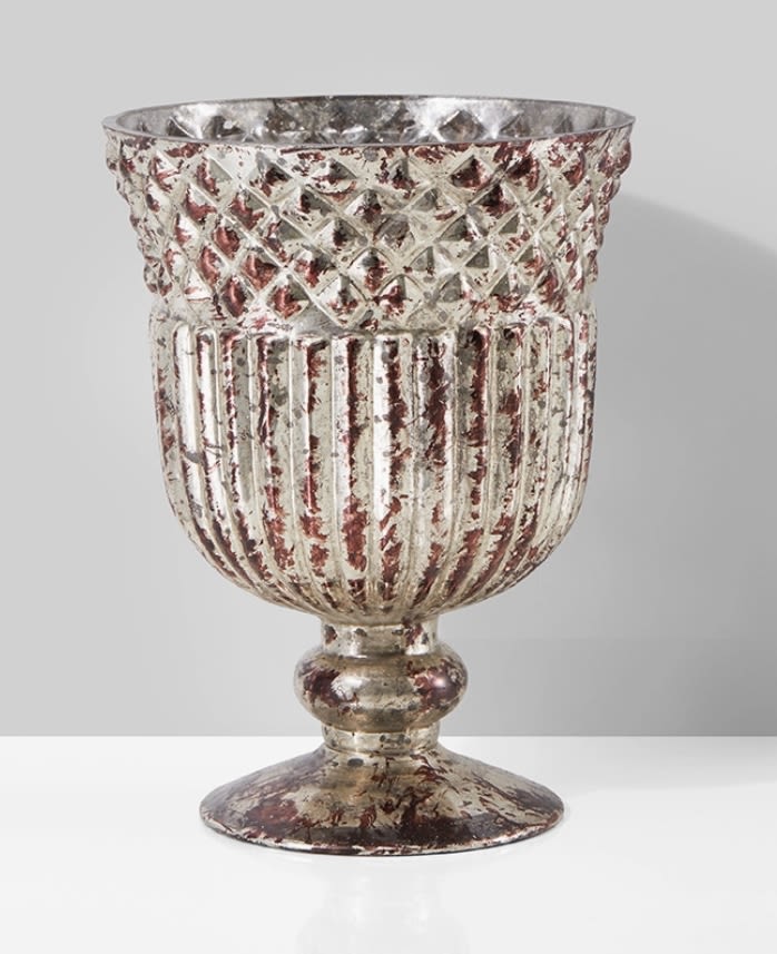 Decorative silver-toned metal urn with a textured, distressed finish