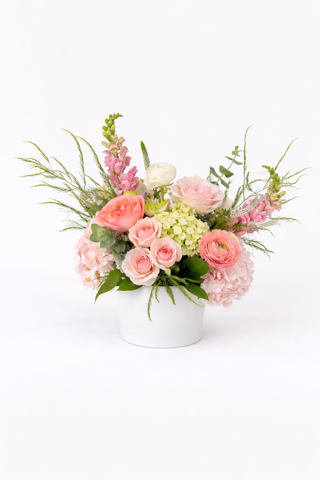 The First Date - A soft and romantic arrangement designed to make a lasting impression. Featuring delicate blush and peach blooms with airy greenery, First Date captures that perfect balance of excitement and elegance—thoughtful, fresh, and unforgettable.