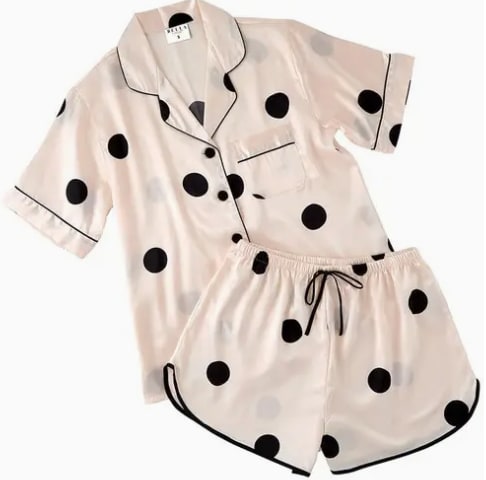 Satin Two-Piece PJ Set - Small - You never know who you'll meet in your dreams! This luxurious silky satin set by Bella Sleep + Spa is perfect for girls' nights and slumber parties. Elastic waistband and button-down shirt make this set extremely comfortable to sleep in.  • Material: 100% Satin Polyester • Care Instructions: Machine Wash Warm, Tumble Dry Low, Non-Chlorine Bleach Only.