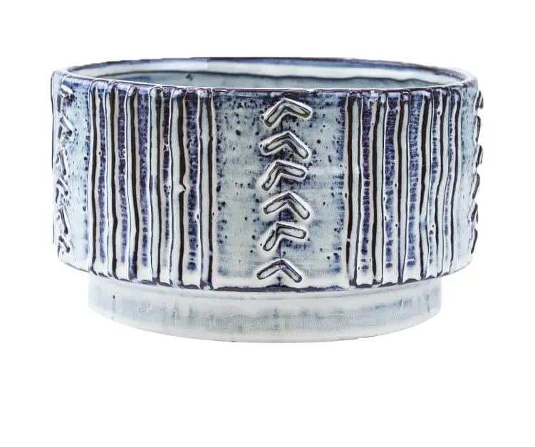 Blue and white ceramic planter with vertical ridges