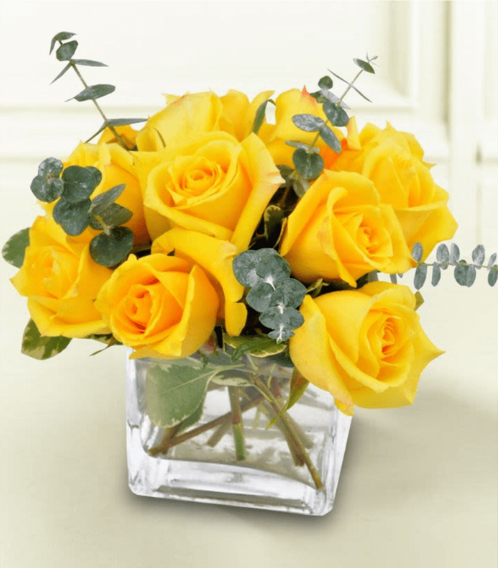 Summer Sun - The bouquet is meticulously arranged inside a modern square glass cube vase, creating a compact, clean, and contemporary look. It is the perfect gift to convey joy, friendship, congratulations, or simply to brighten up any home or office space. Approximate dimensions: Height 10, Width 8.5