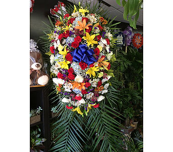 always adored spray - by Lovely Blooms Decorations - yellow and orange lilies red roses blue hydrengea white alstro white spider white deysis and red carnetios As Shown : 2017SYM009
