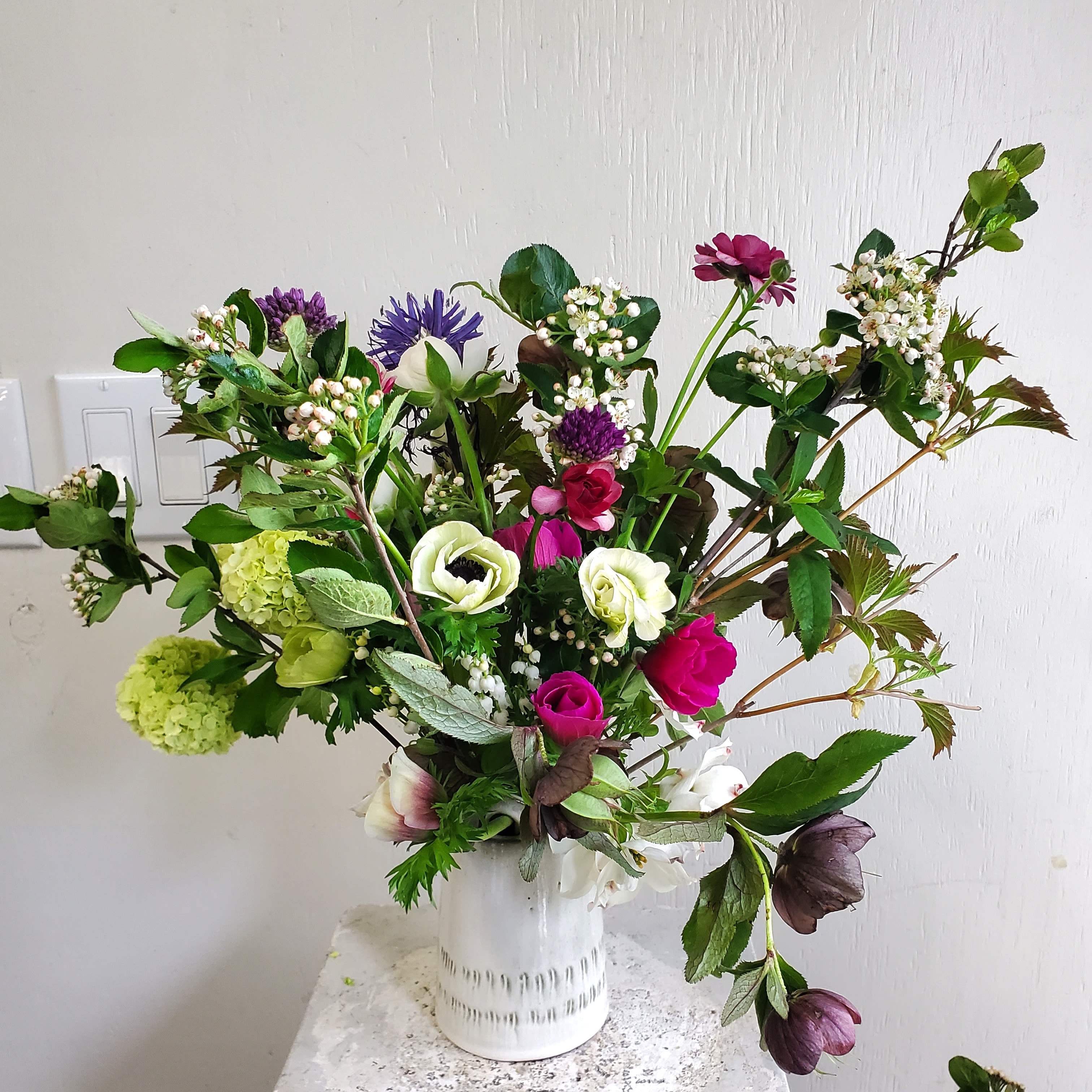 Mild Mandi - We are a small studio florist in a small town. Every bouquet we create is a one-of-a-kind creation, tailored to the season, availability of flowers, color choice, artistic interpretation, and the current materials available. The photos do not represent the exact flowers that will be delivered. They are intended to provide you with an idea of  the variance that can be expected.  The season, availability of flowers,interpretation, and the current materials available.  